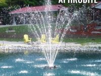 APHRODITE fountain nozzle creating a stunning spray display in a pond