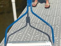 Beachroller2020-e1645199420661.jpg - Pond Perfections Close-up of the Beachroller lake weed removal tool with a durable 20ft handle and stainless steel blades.