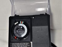 Intermatic 24-hour timer with protective cover."