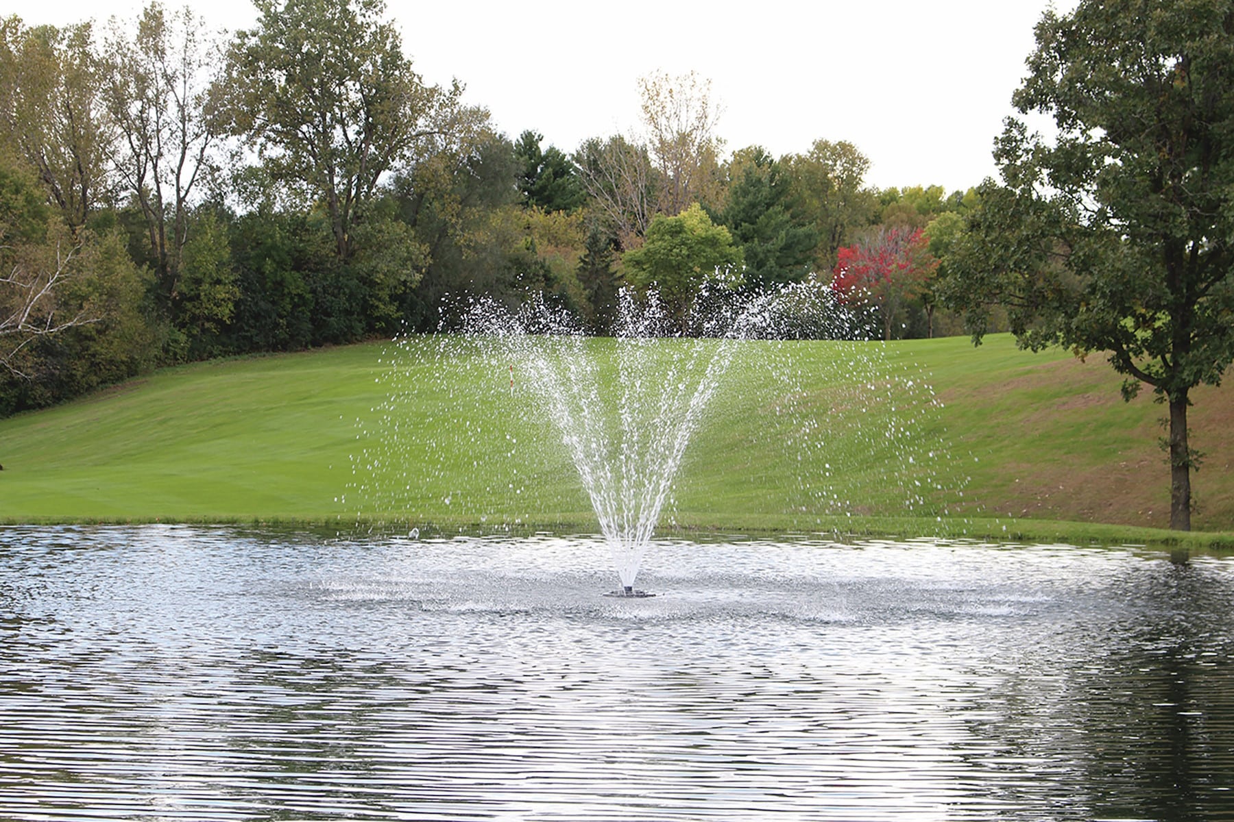 Kasco-4400-Cypress - Pond Perfections Kasco 4400 Cypress 1 HP J Series Fountain with a multi-tiered spray pattern in a pond.