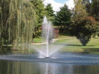 Kasco 4400 1 HP J Series Decorative Floating Fountain enhancing a pond's beauty.