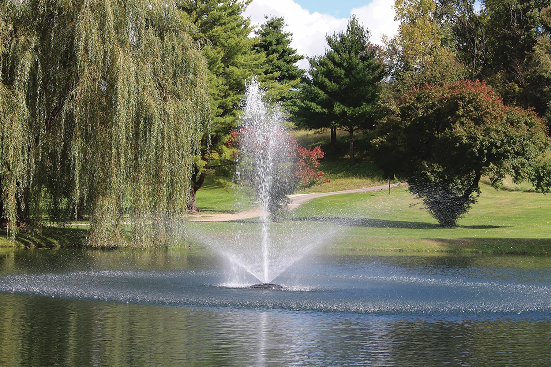 Kasco-4400-Linden - Pond Perfections Kasco 4400 1 HP J Series Decorative Floating Fountain enhancing a pond's beauty.